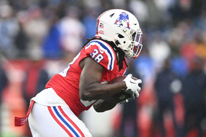 Dec 3, 2023; Foxborough, Massachusetts, USA; New England Patriots running back Rhamondre Stevenson (38) rushes against the Los Angeles Chargers during the first half at Gillette Stadium.